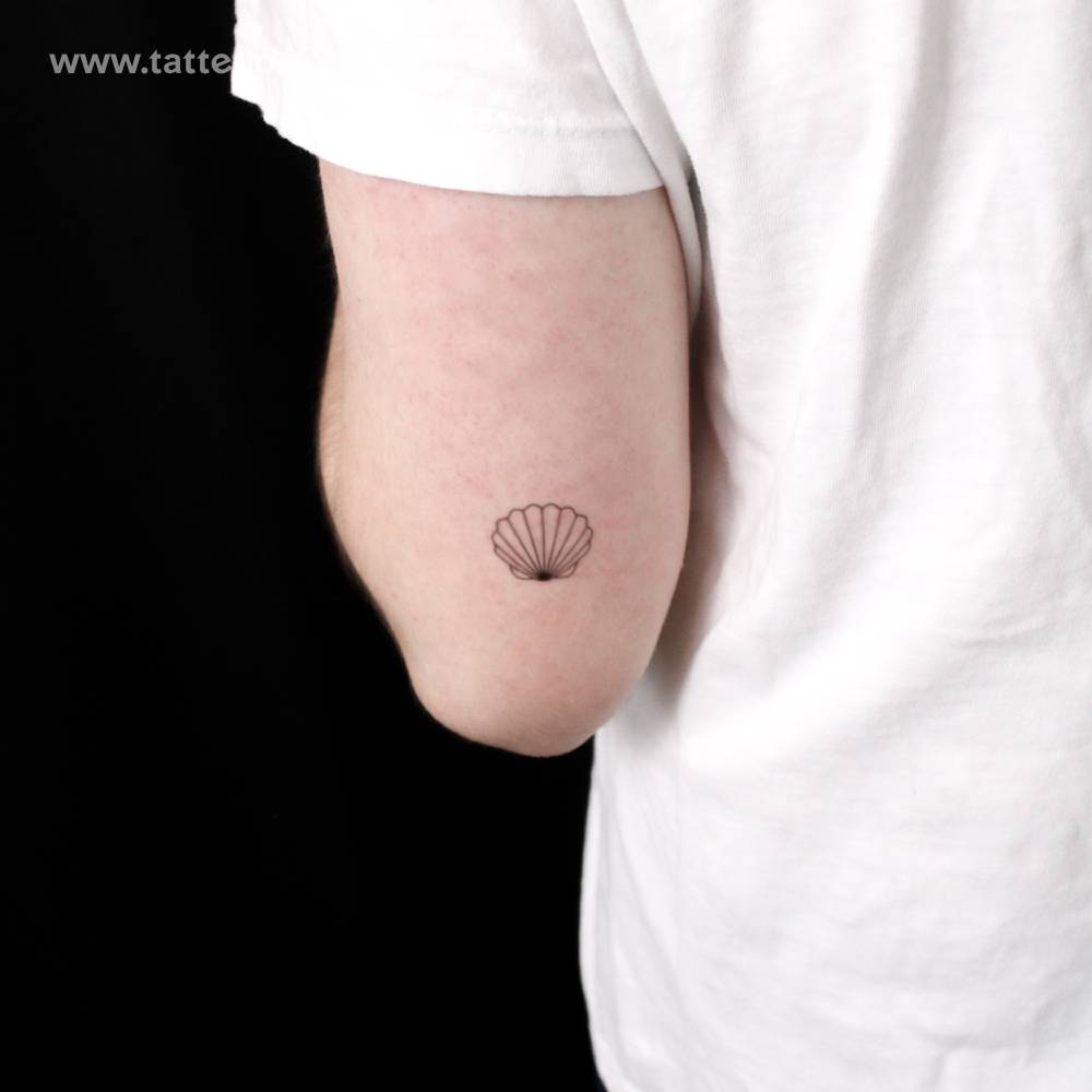 Scallop shell semi-permanent tattoo located on the tricep.
