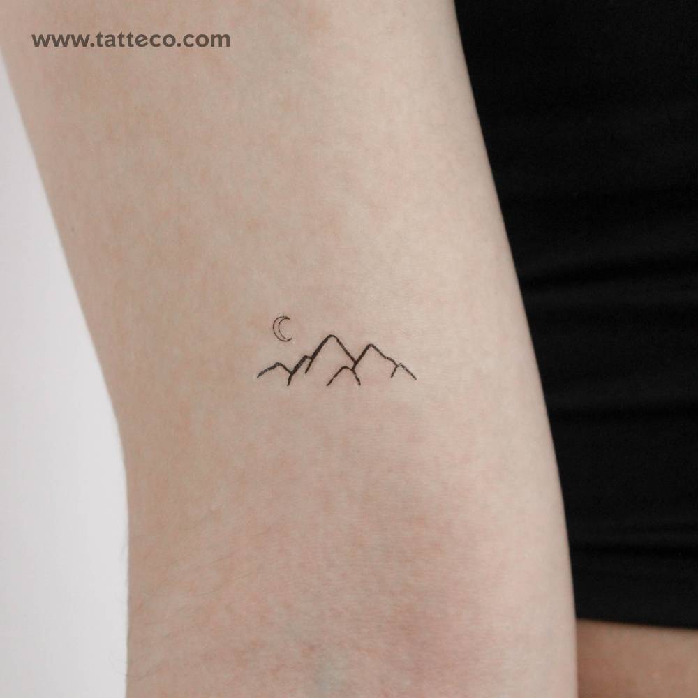 Minimalist style mountain range temporary tattoo.