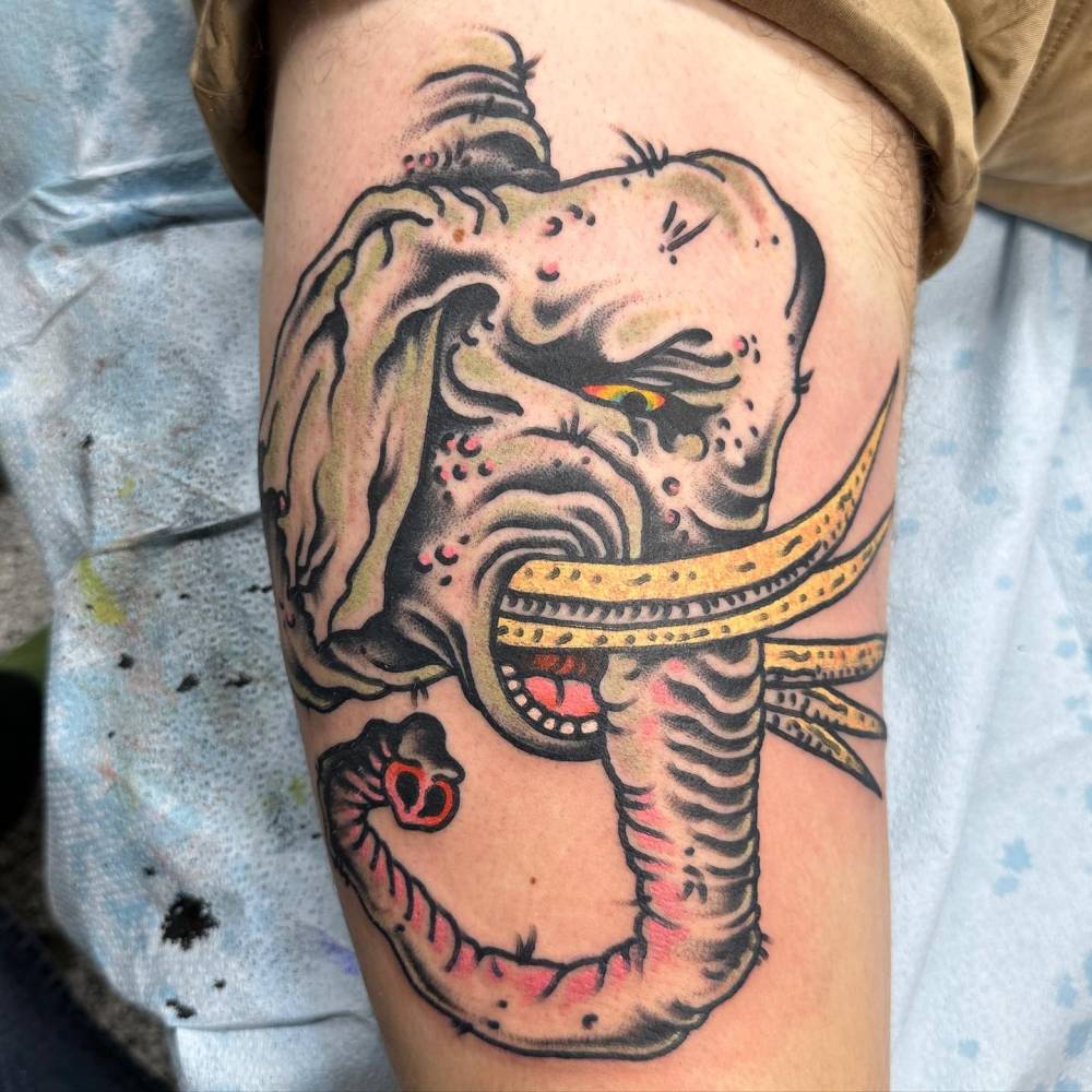 Traditional style elephant tattoo located on the thigh.