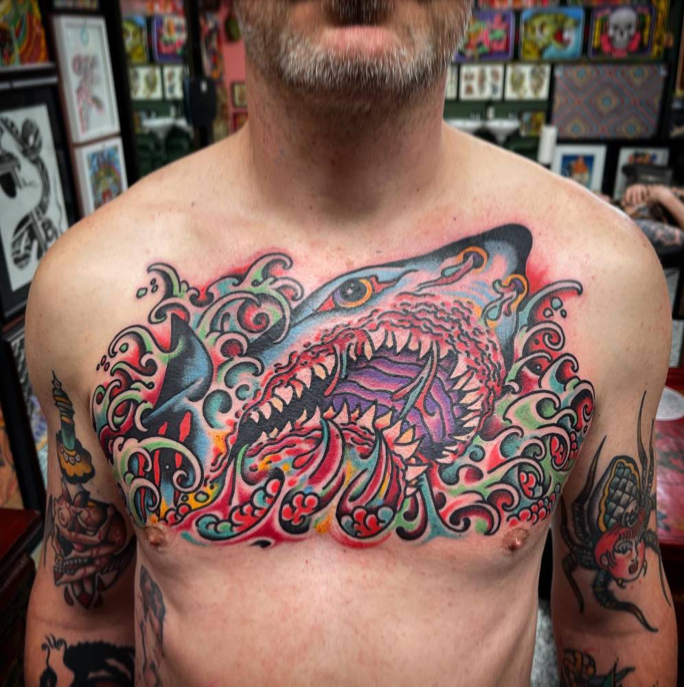 Shark tattoo in traditional style located on the chest.