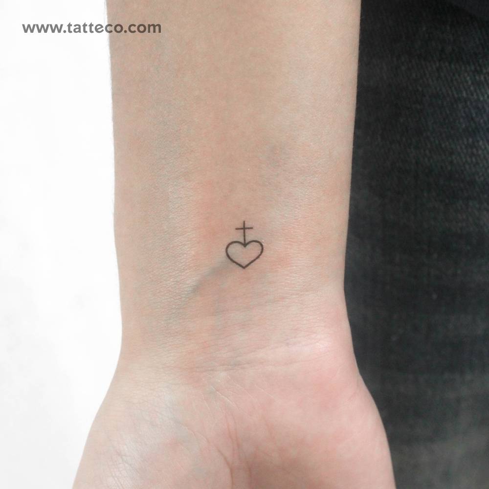 Tiny minimalist heart and cross temporary tattoo.
