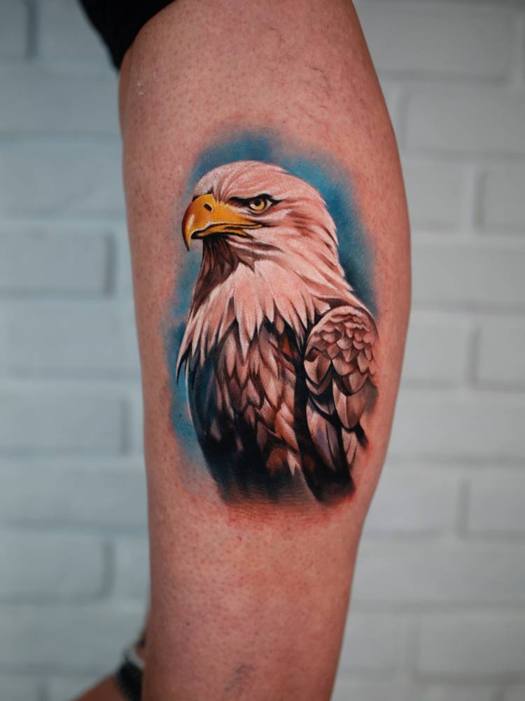 Eagle portrait tattoo in realism located on the calf.