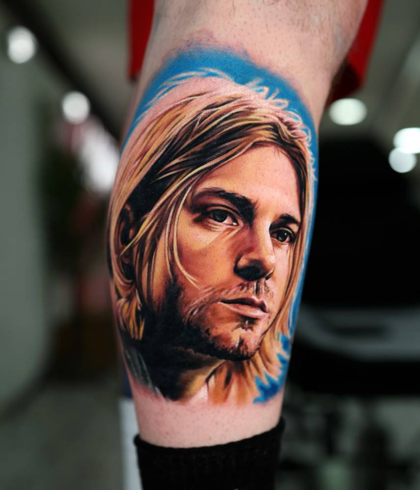 Kurt Cobain portrait tattoo in realism done on the calf.