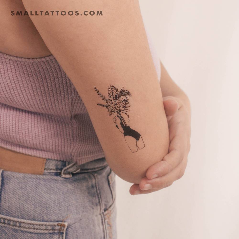Flower head woman temporary tattoo located on the tricep.