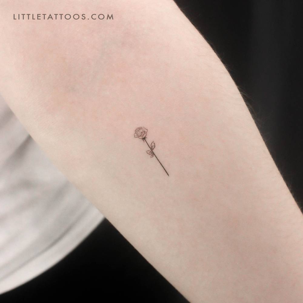 Black rose outline temporary tattoo located on the inner forearm.