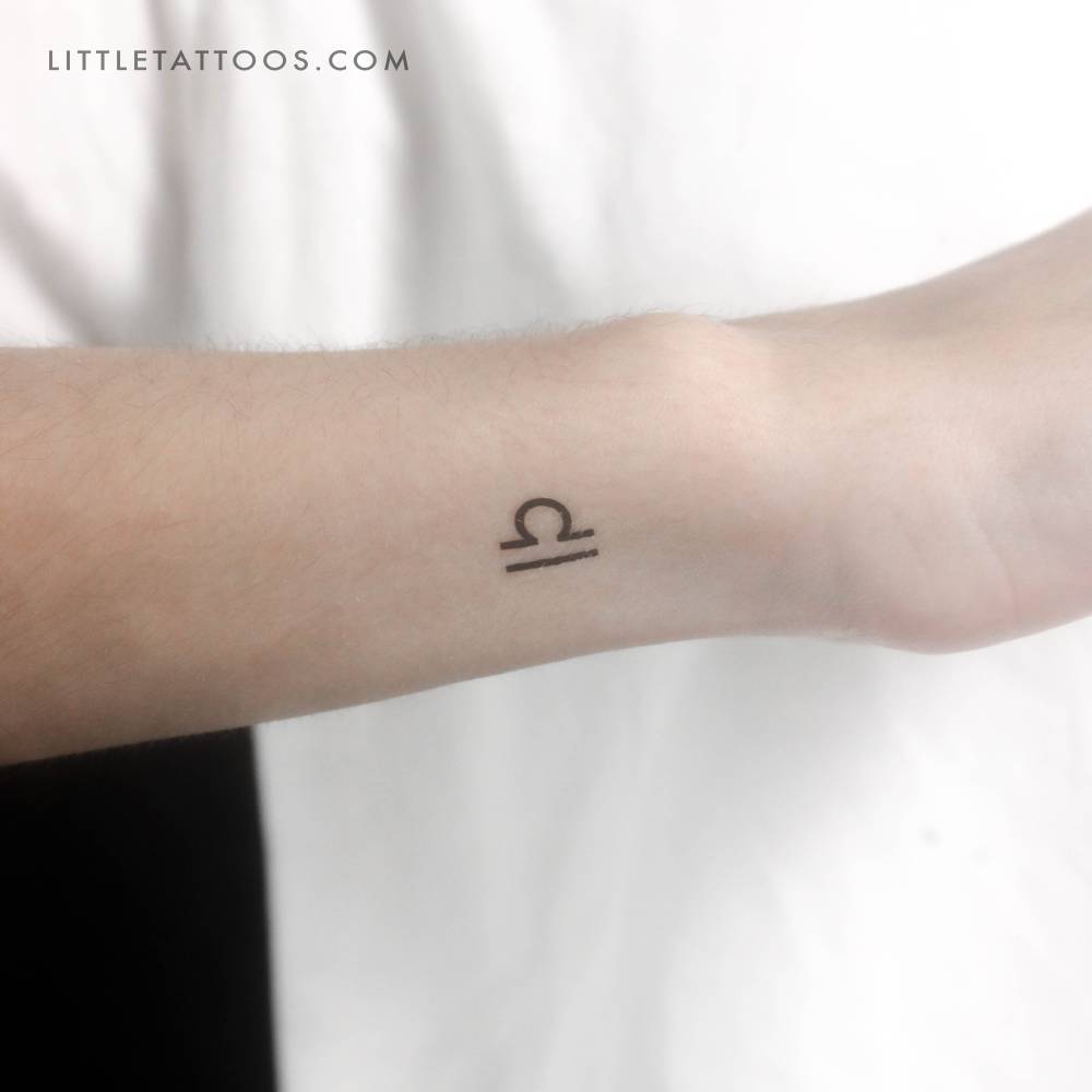 Tiny Libra zodiac symbol temporary tattoo.