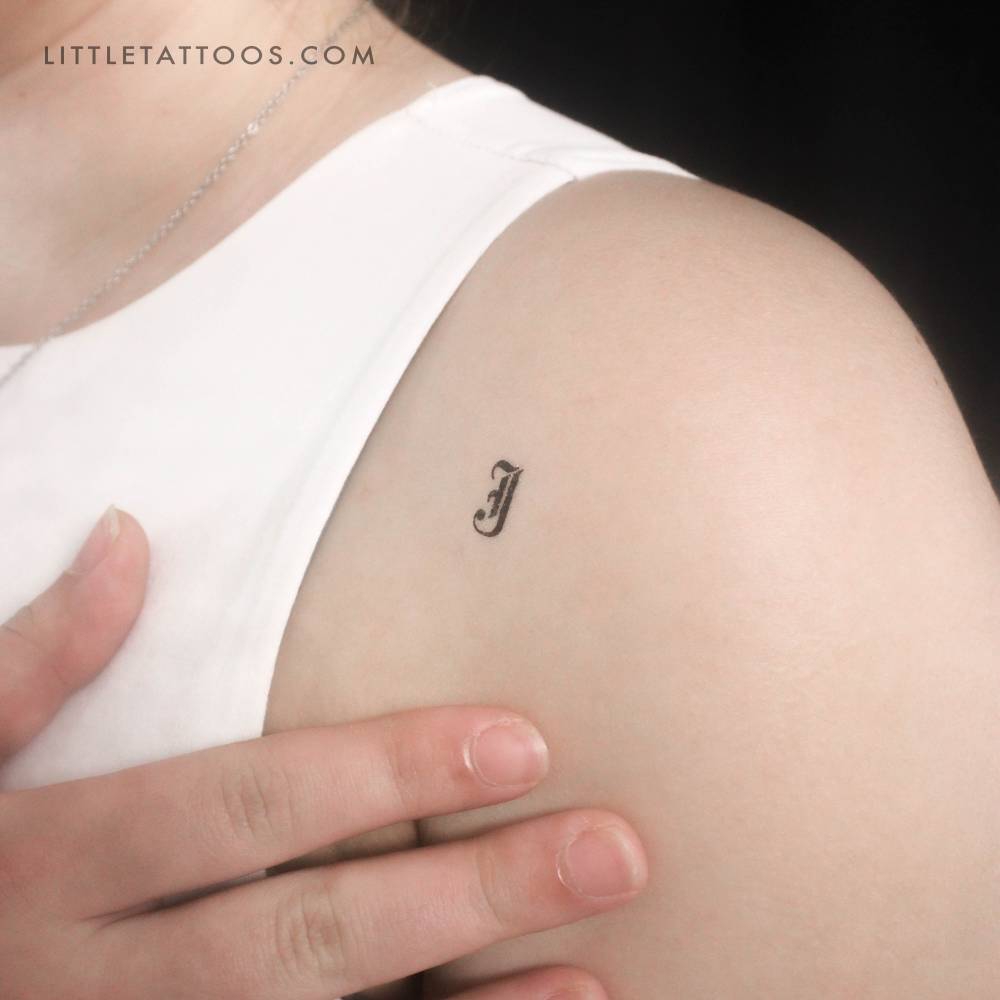 Gothic "J" letter temporary tattoo located on the shoulder.