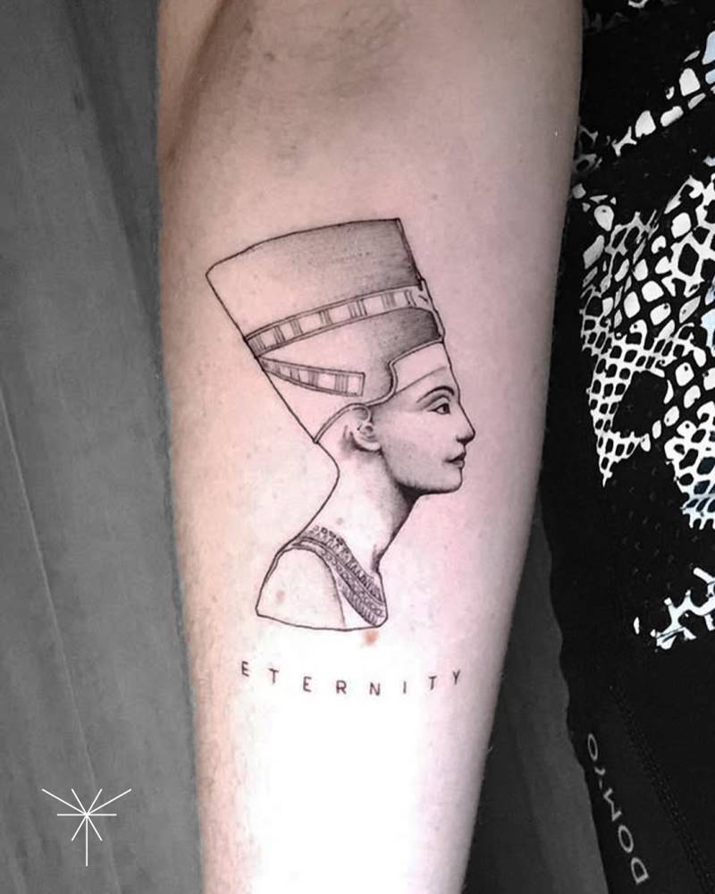Illustrative style Nefertiti tattoo located on the inner forearm.