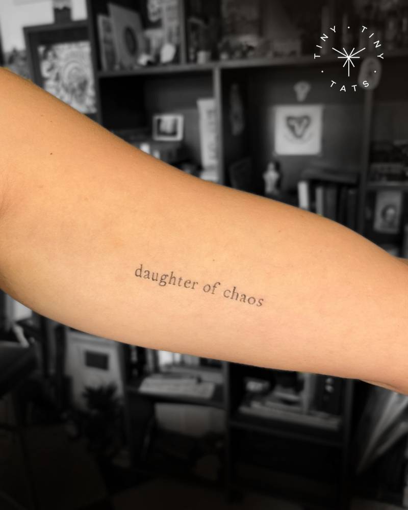 Daughter of chaos tattoo located on the inner arm.