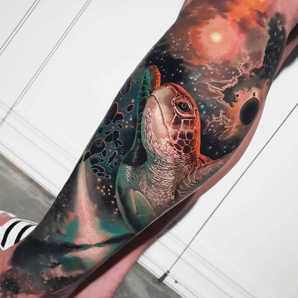 Realistic style turtle tattoo located on the shin.