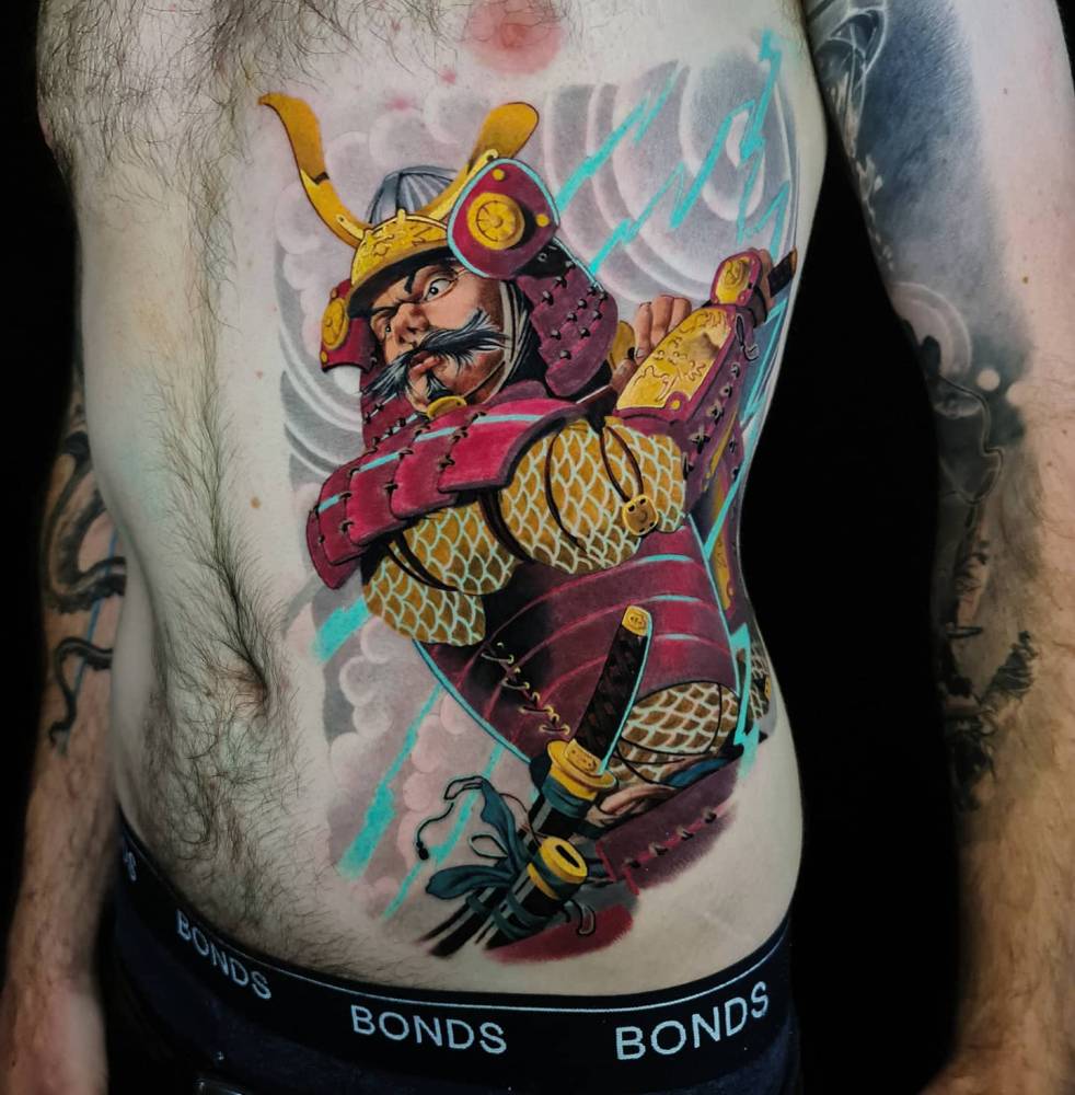 Oriental style samurai tattoo located on the rib.
