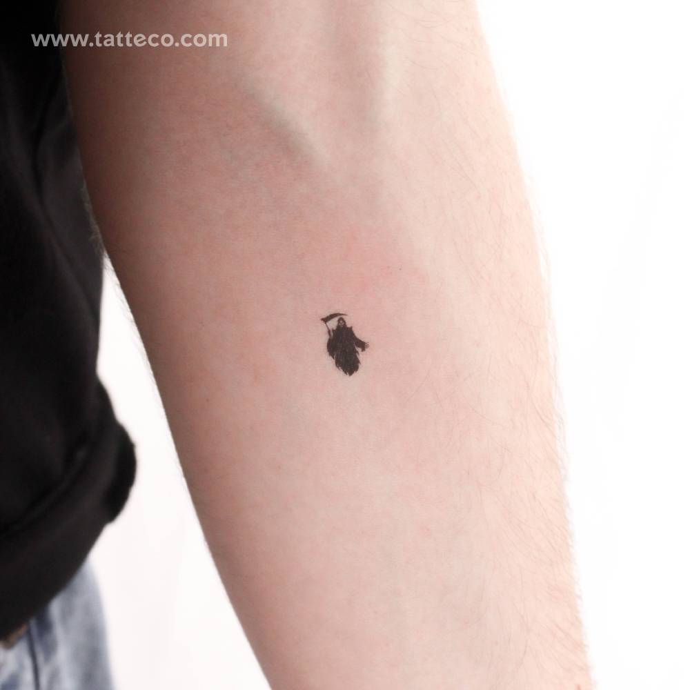 Small Grim Reaper temporary tattoo placed on the inner forearm.