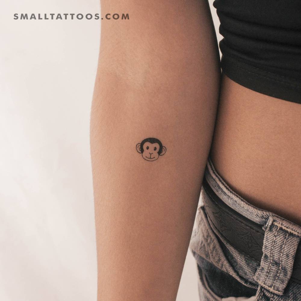 Monkey face temporary tattoo located on the inner forearm.
