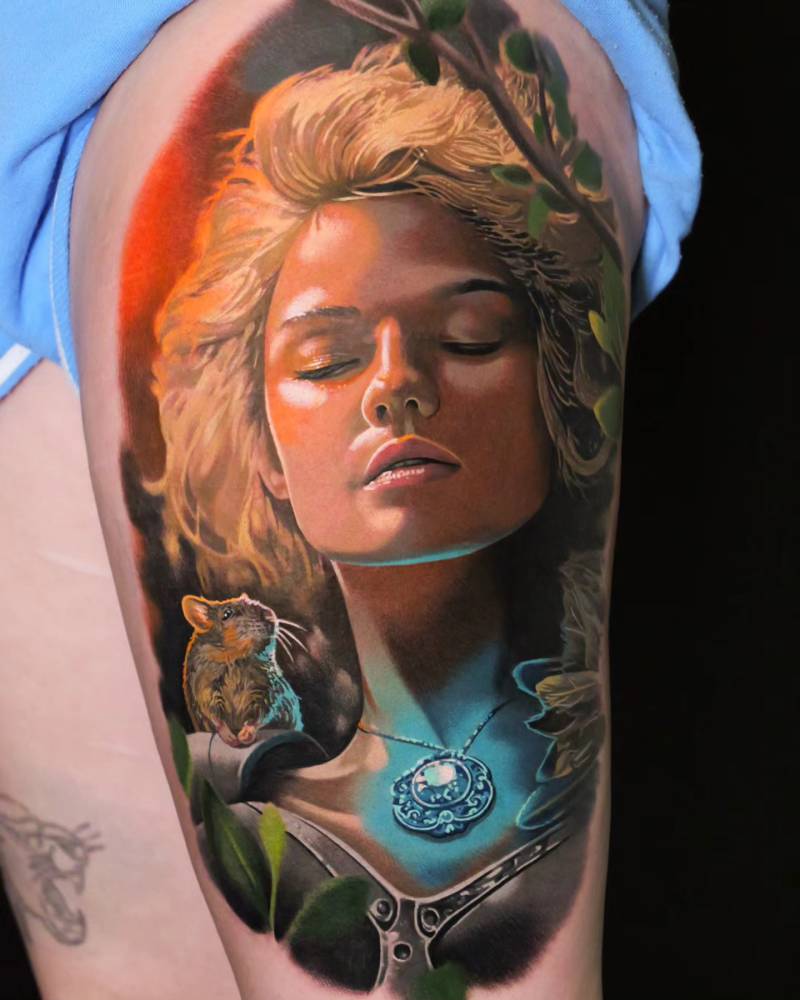 Freya portrait tattoo in realistic style done on the thigh.