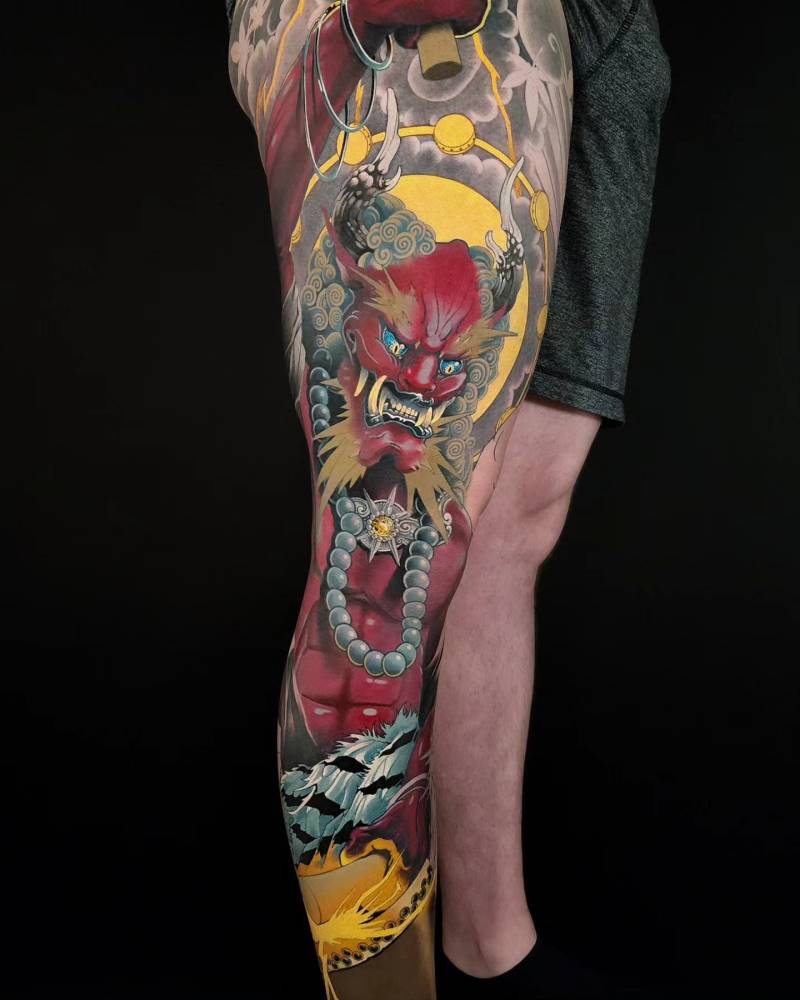 Raijin leg sleeve tattoo in oriental style.