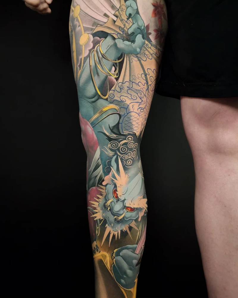 Fujin leg sleeve tattoo in oriental style.