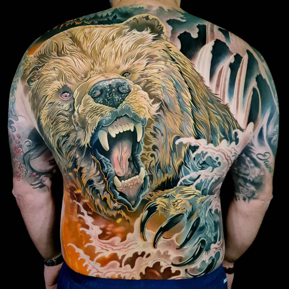 Neotraditional style grizzly bear backpiece tattoo.