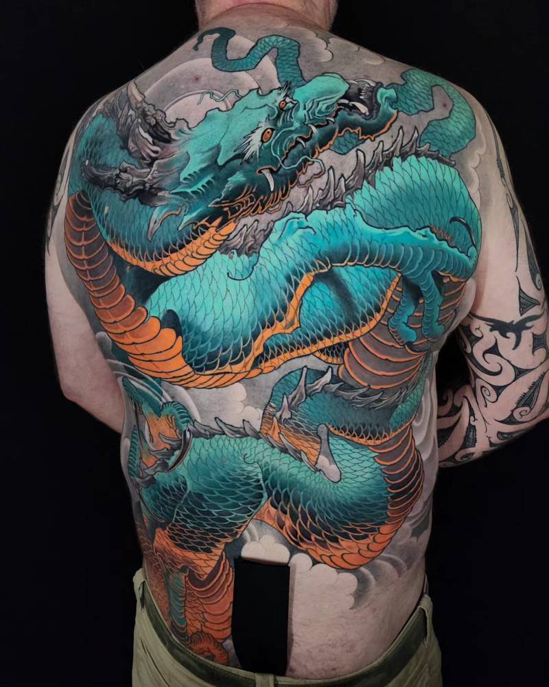 Oriental style dragon backpiece tattoo.