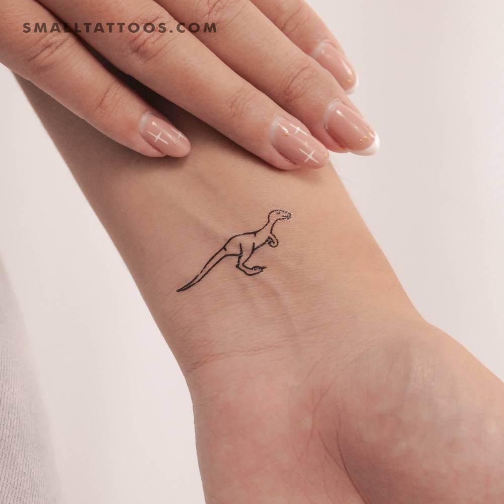 Velociraptor temporary tattoo located on the wrist.
