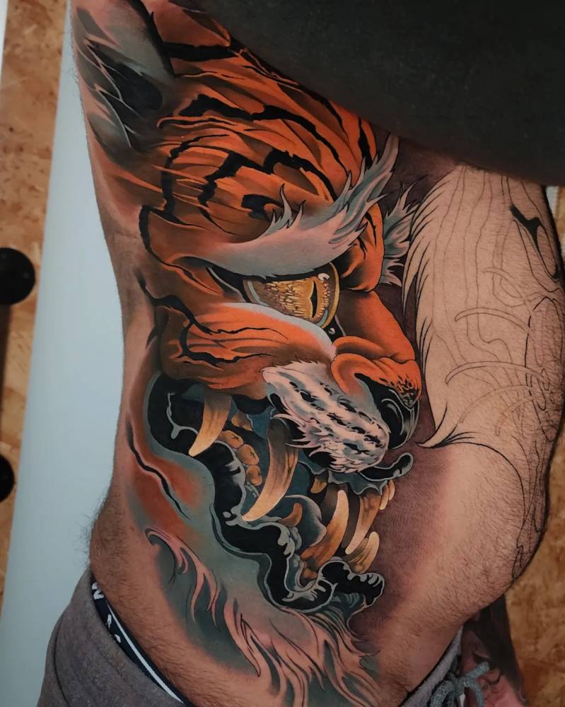 Tiger hannya tattoo located on the rib, oriental style.