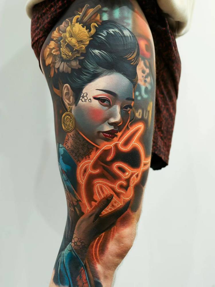 Geisha portrait tattoo located on the thigh, oriental style.
