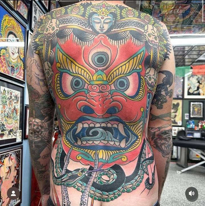 Hannya backpiece tattoo in traditional style.
