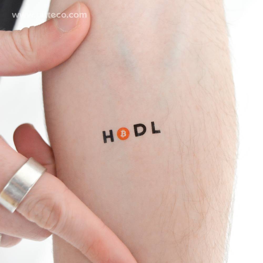 Bitcoin HODL temporary tattoo located on the inner forearm.