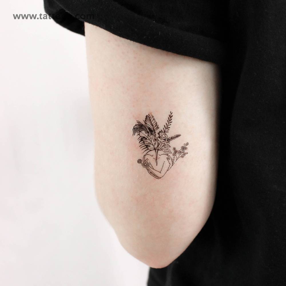 Blossom temporary tattoo located on the tricep.