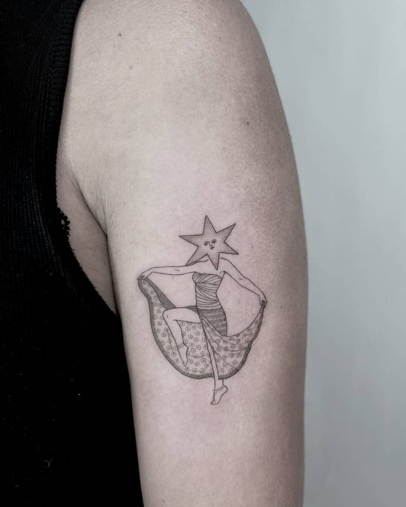 Star headed dancer tattooed on the upper arm.