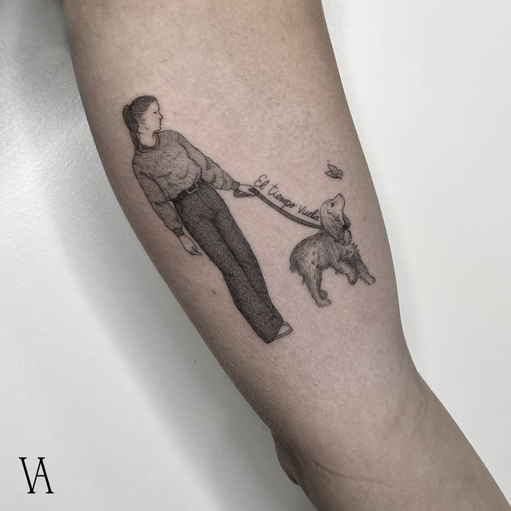 Illustrative style dog walking tattoo located on the inner arm.
