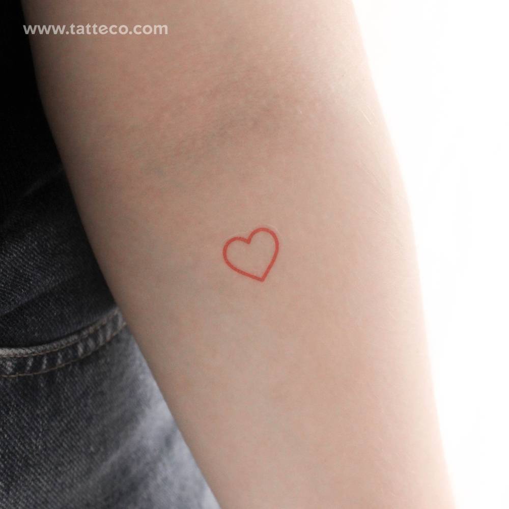 Red heart outline temporary tattoo located on the inner forearm.