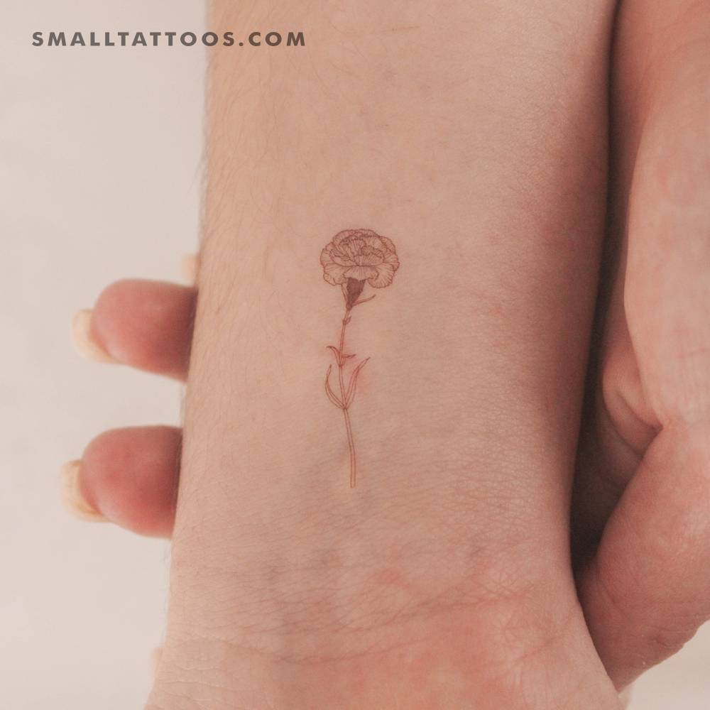 Red carnation temporary tattoo located on the wrist.