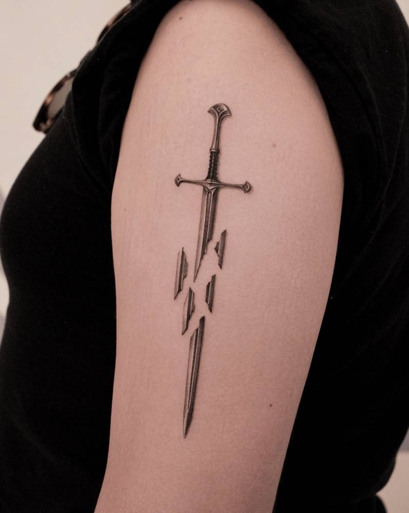 The Lord of the Rings sword tattooed on the upper arm.