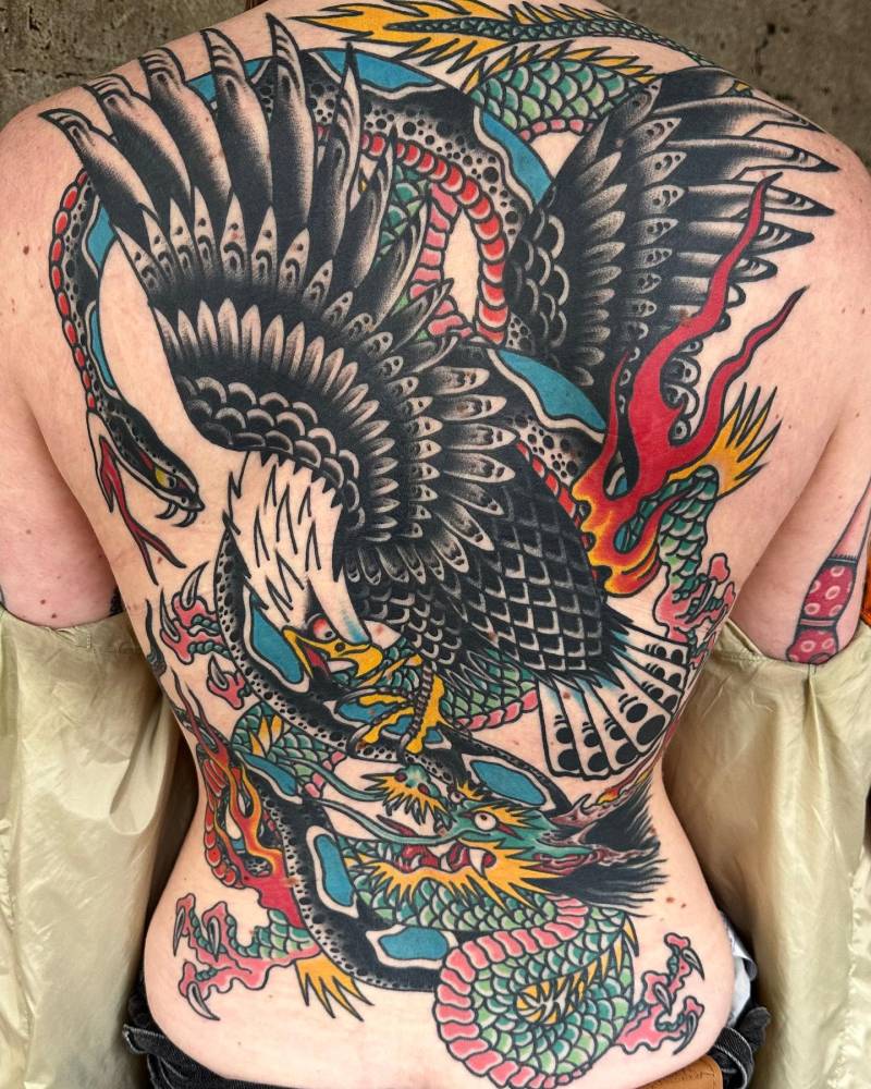 Battle royale backpiece tattoo in traditional style.