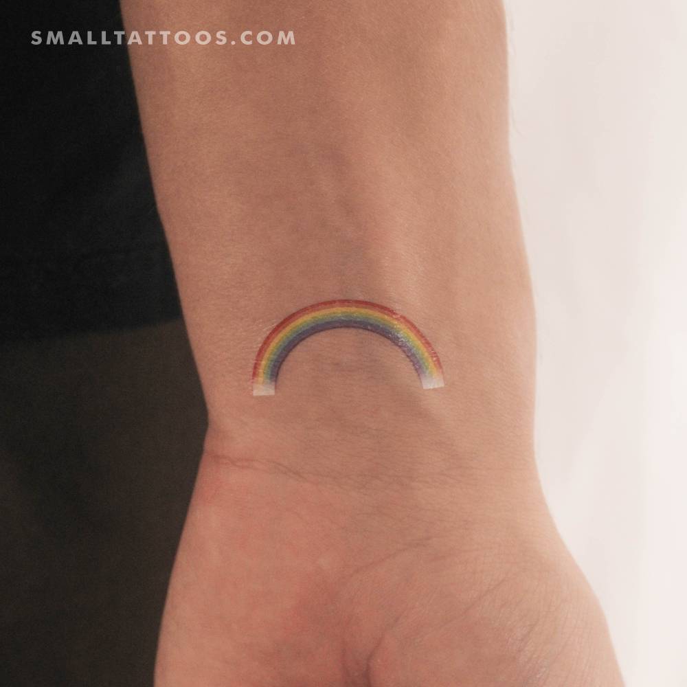 Color rainbow temporary tattoo located on the wrist.