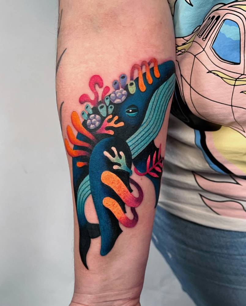 Whale and corals tattoo done on the inner forearm.