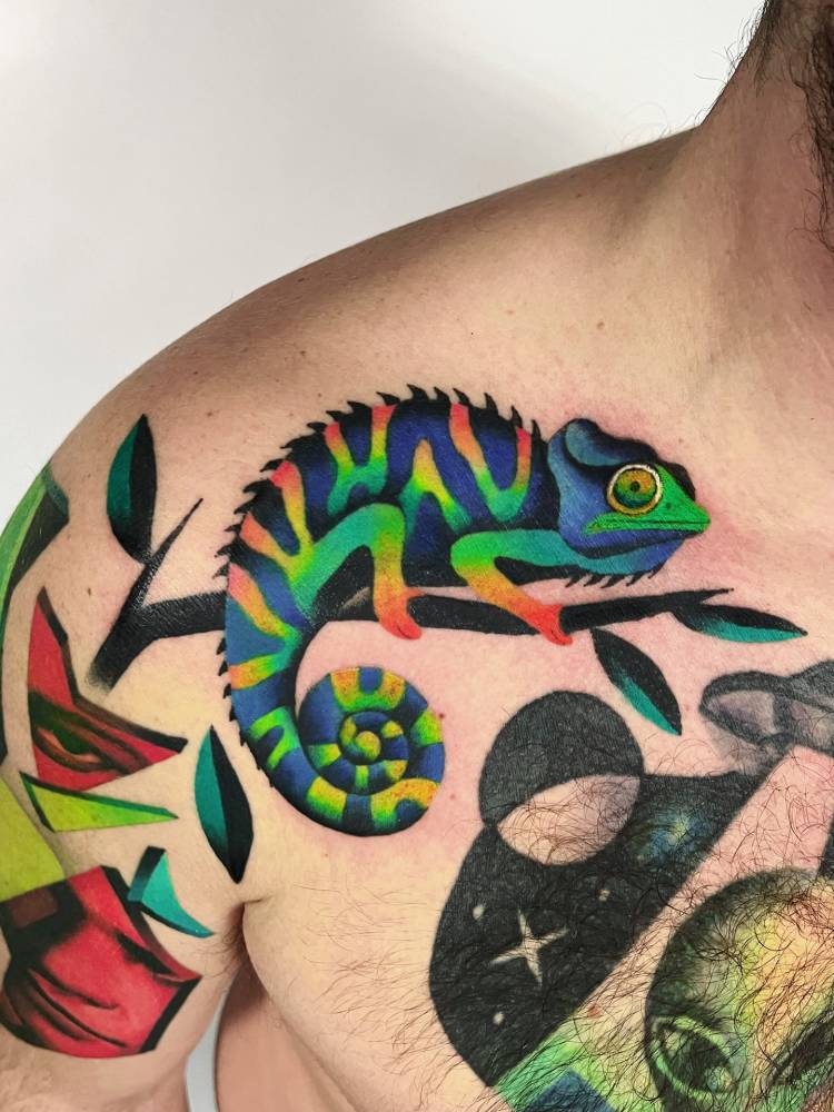 Chameleon tattoo in pop art style located on the shoulder.
