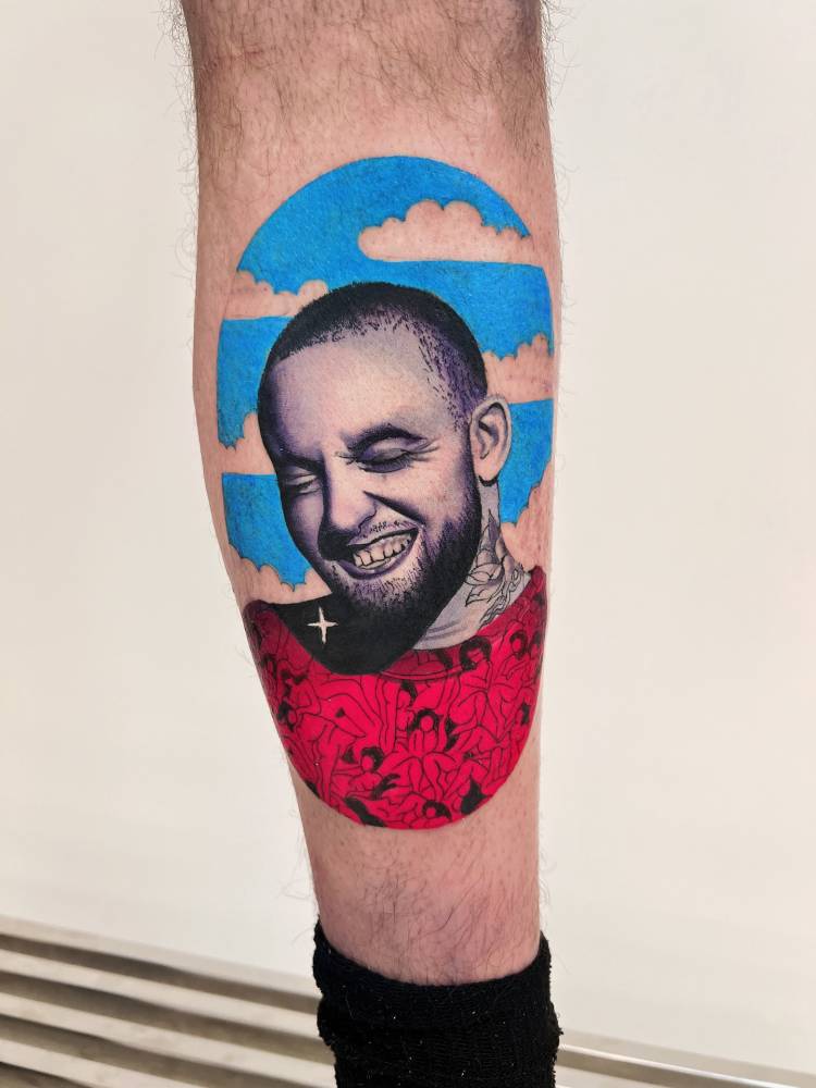 Mac Miller portrait tattoo located on the calf, pop art style.