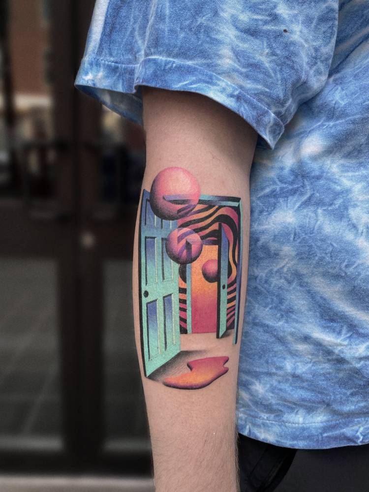 Surrealistic style door tattoo located on the forearm.