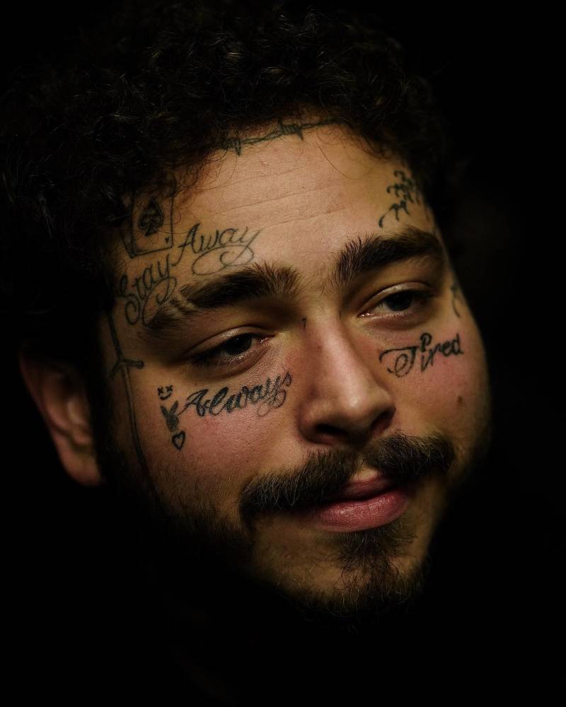 Post Malone's face lettering tattoos.