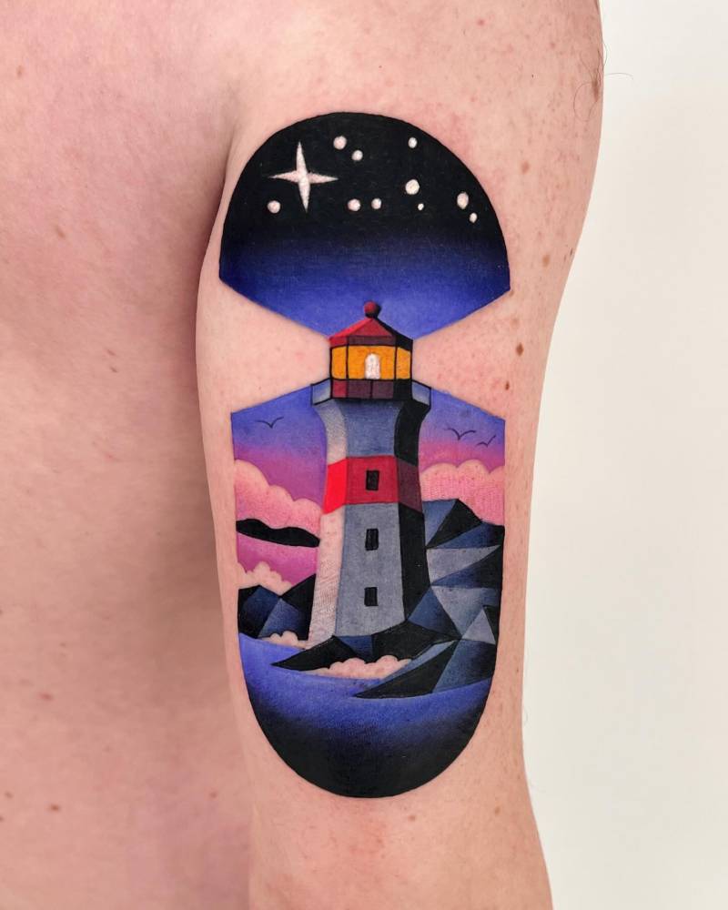 Lighthouse tattoo located on the tricep, pop art style.