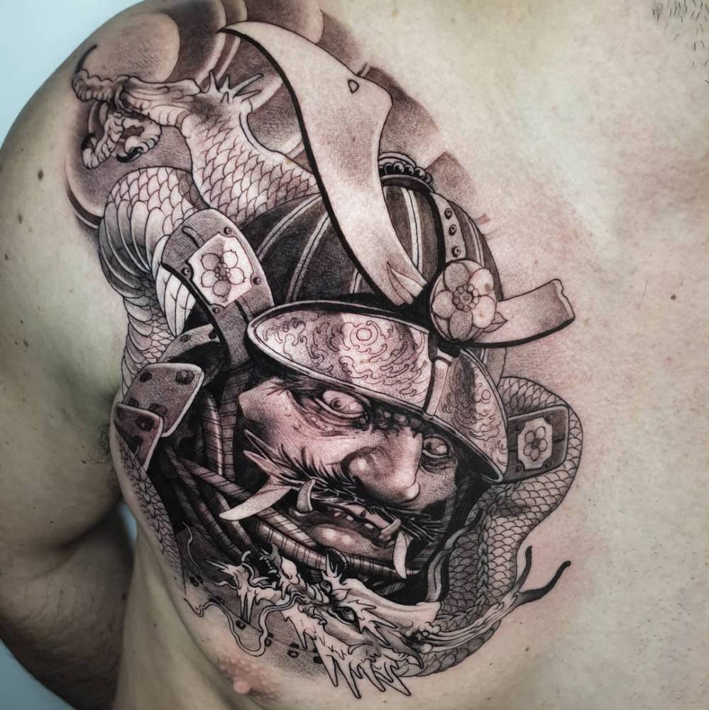 Samurai portrait tattoo in neotraditional style located on the chest.
