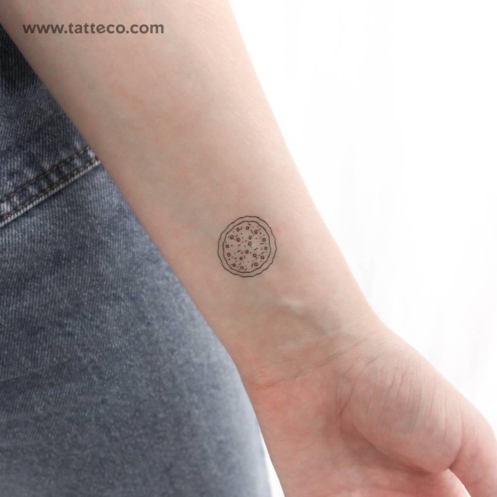 Pizza temporary tattoo located on the wrist.