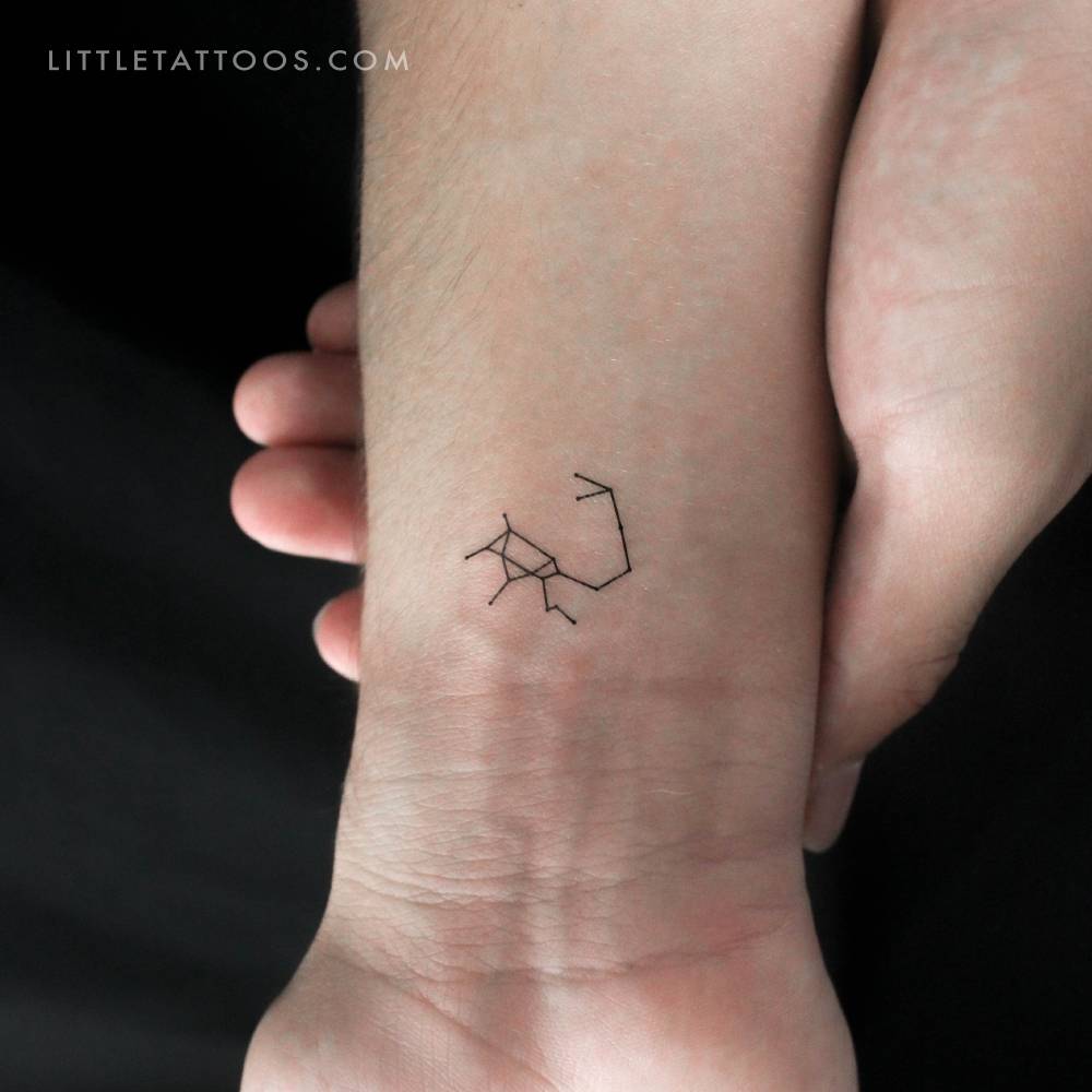 Minimalist tiny Sagittarius constellation temporary tattoo.