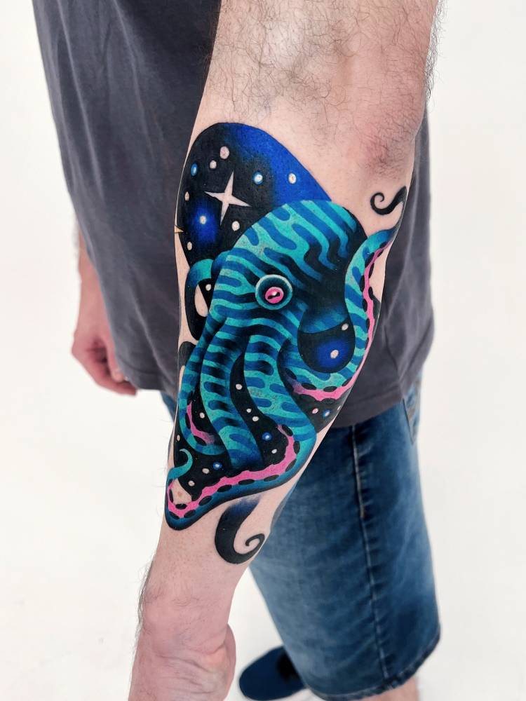 Space octopus tattoo located on the forearm, pop art style.