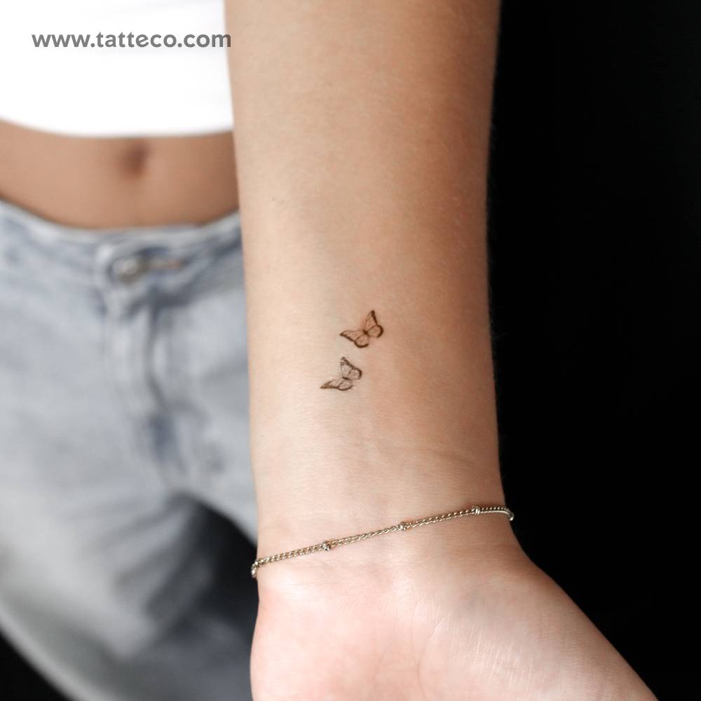 Small butterfly pair semi-permanent tattoo.