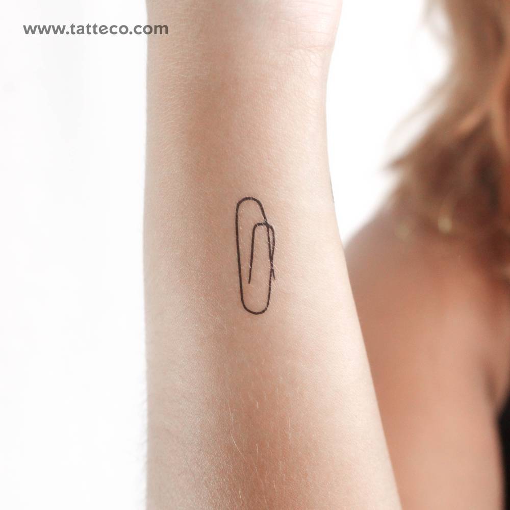 Paper clip temporary tattoo located on the wrist.