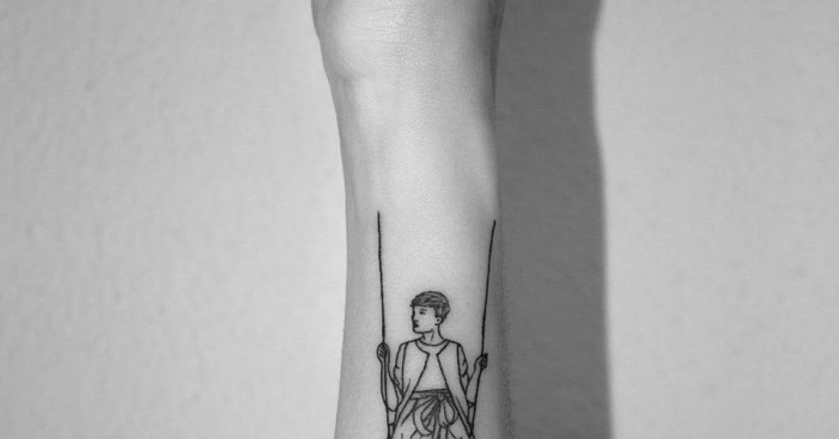 Child in a swing tattoo on the left forearm.