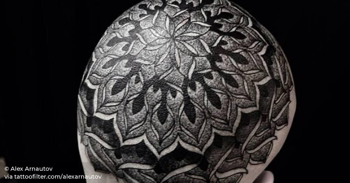 Blackwork mandala tattoo on the head.